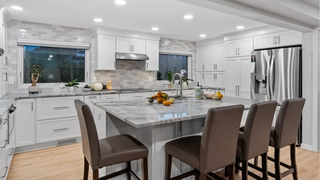 This Modern Kitchen Creates a Spacious and Inviting Atmosphere, Perfect for Cooking and Socializing.