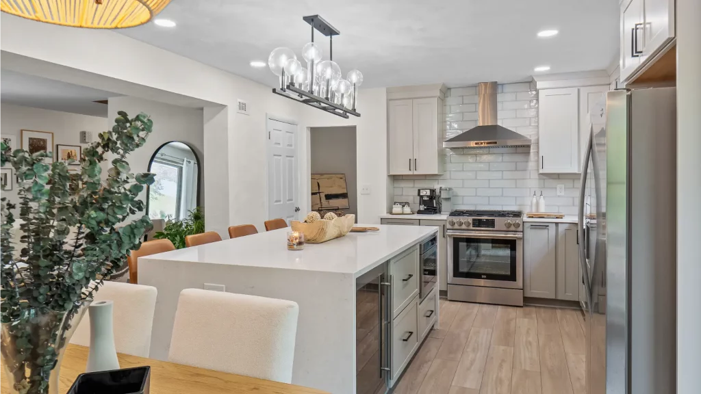 This Bethel Park Kitchen Boasts a Streamlined, Modern Design with White Cabinets and Stainless-Steel Appliances.