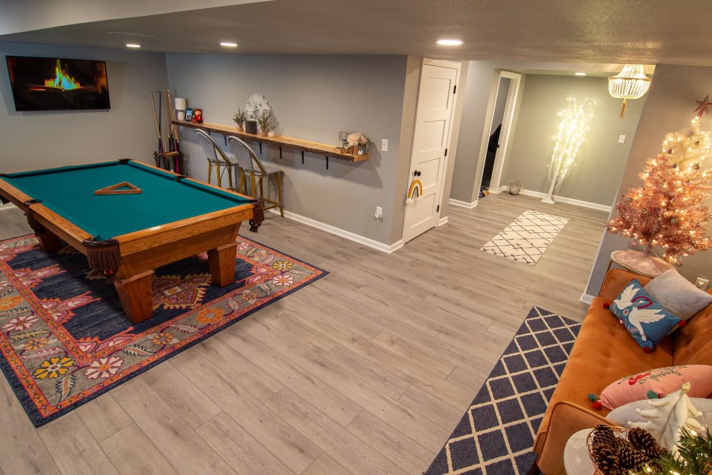 Entertainment Area for Family and Friends Utilizing Open Space to Shoot Pool and Watch Favorite Sports Teams