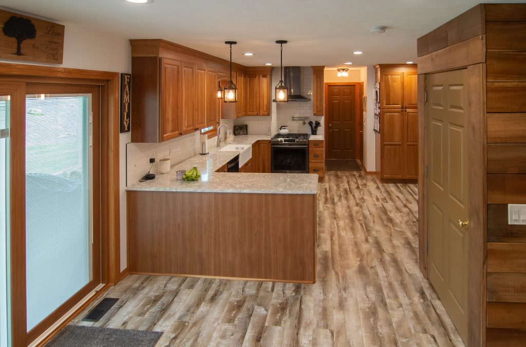 Warm Rustic Cranberry Style Kitchen Accented with Rough Cut Lumber to Give that Cabin Look