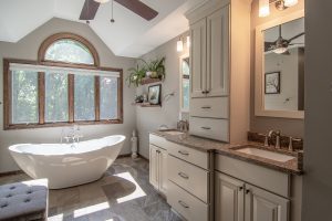 Traditional Style Master Bathroom with stand-alone soaking tub.