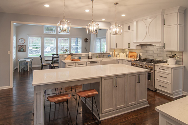 A kitchen remodeling showroom with a beautiful model of a modern kitchen and samples being displayed.