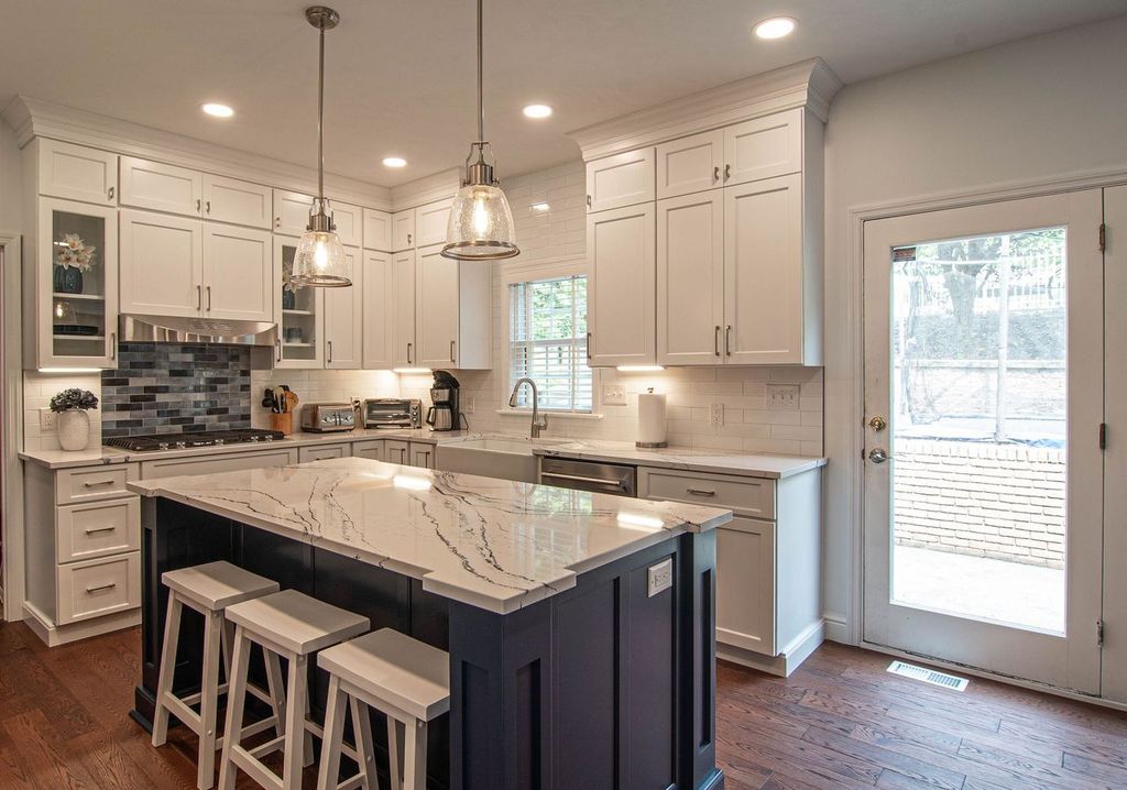 Picture of a Wexford, PA, traditional-style, two-tone kitchen using the shaker door style and maximizing space by double-stacking cabinets.