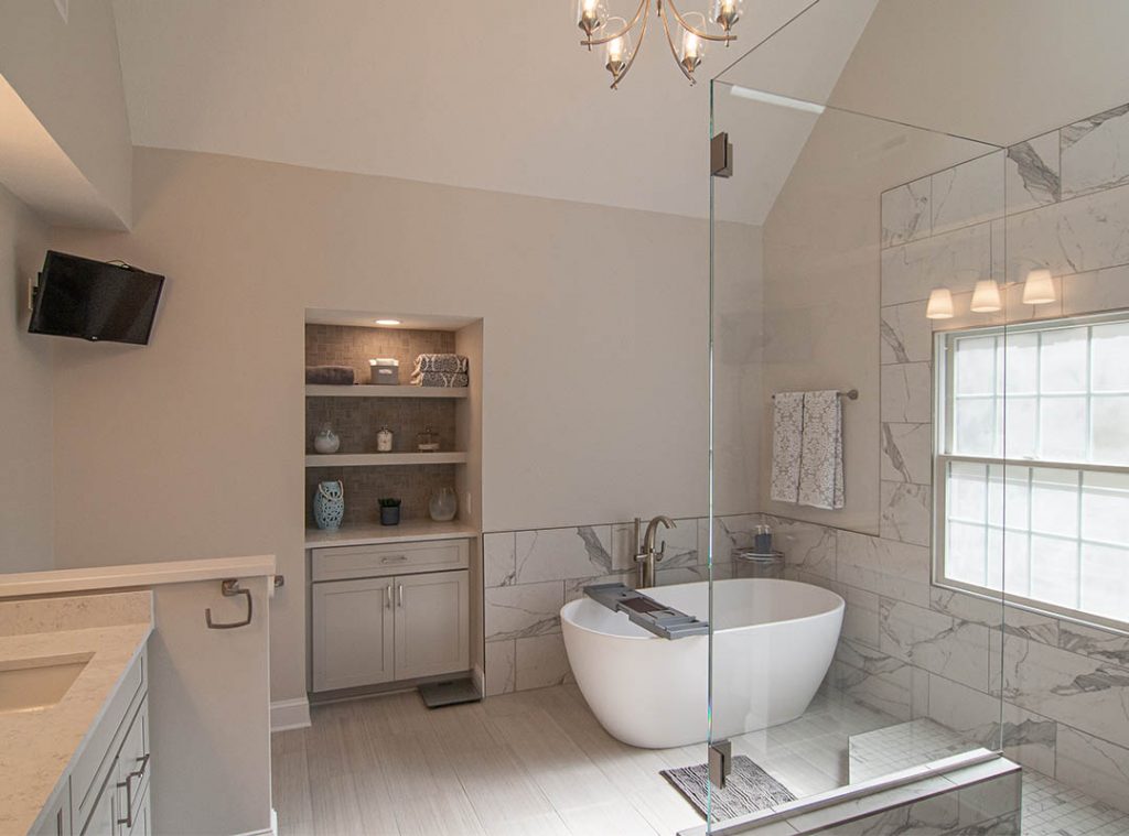 Modern take on a Coraopolis master bathroom focusing on architectural lines and custom cut clear glass walk-in shower.