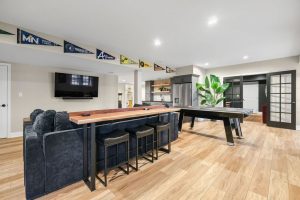 Modern Pittsburgh Basement Remodel Featuring Kitchenette and TV Area Create a Cozy and Inviting Spot for Socializing or Unwinding.