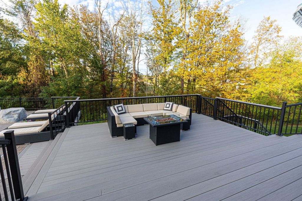 Modern Fox Chapel Deck Featuring an Outdoor Lounge Design that is Both Luxurious and Serene. Ideal for Evening Gatherings, Fireside Conversations or Peaceful Solo Relaxation