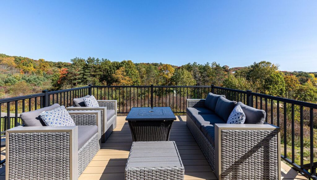 This Gibsonia Contemporary Deck Featuring Modern Black Metal Railing Gives It a Cozy Serene Vibe Perfect for Relaxing and Enjoying the View.