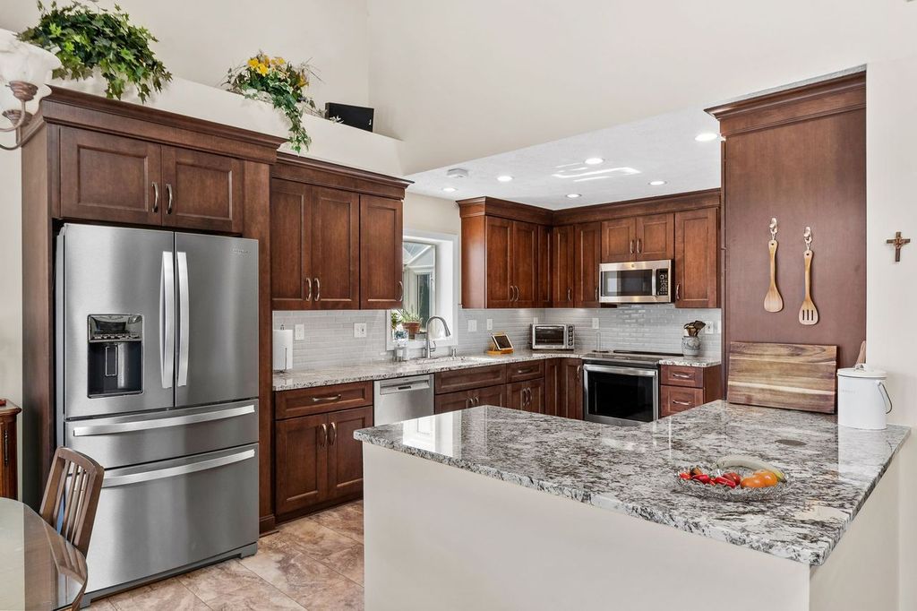 Warmth is Added to this Franklin Park Kitchen Through the Wood Tones, Creating a Cozy Yet Elegant Atmosphere that Blends Perfectly with Refined Style.