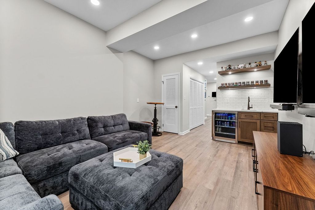 Stylish Monroeville Basement Featuring a Cozy Multifunctional Entertainment Area Perfect for Family Time and Hosting Parties.