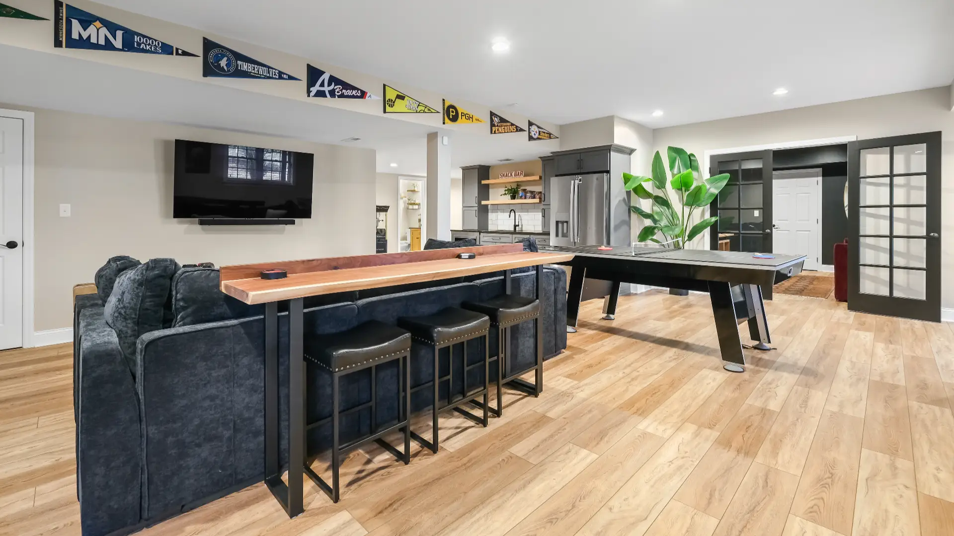 Modern Murrysville kitchenette and TV area creating a cozy spot for socializing and unwinding.