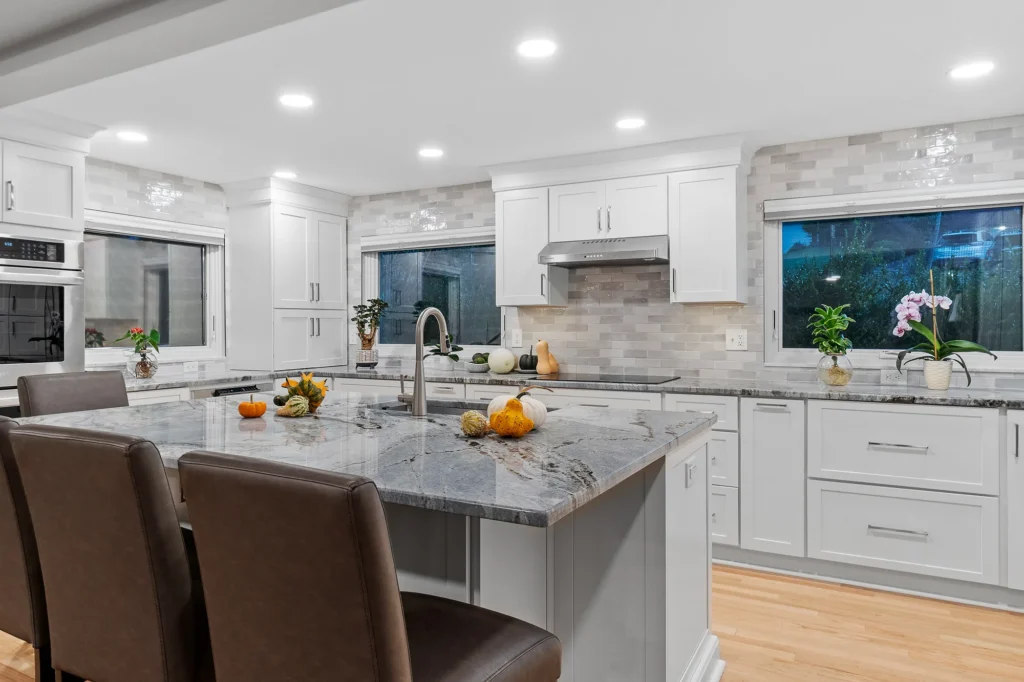 Modern Transitional Mt. Lebanon Kitchen with White Shaker Cabinetry, Sleek Hardware and Custom Built-ins Introduces a Contemporary Edge with a Hint of Sophistication.