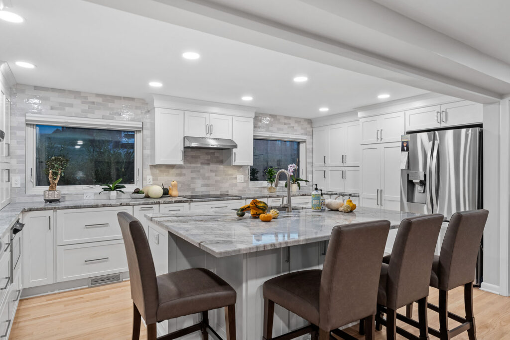 Modern Transitional Mt. Lebanon Kitchen with White Shaker Cabinetry, Sleek Hardware and Custom Built-ins Introduces a Contemporary Edge with a Hint of Sophistication