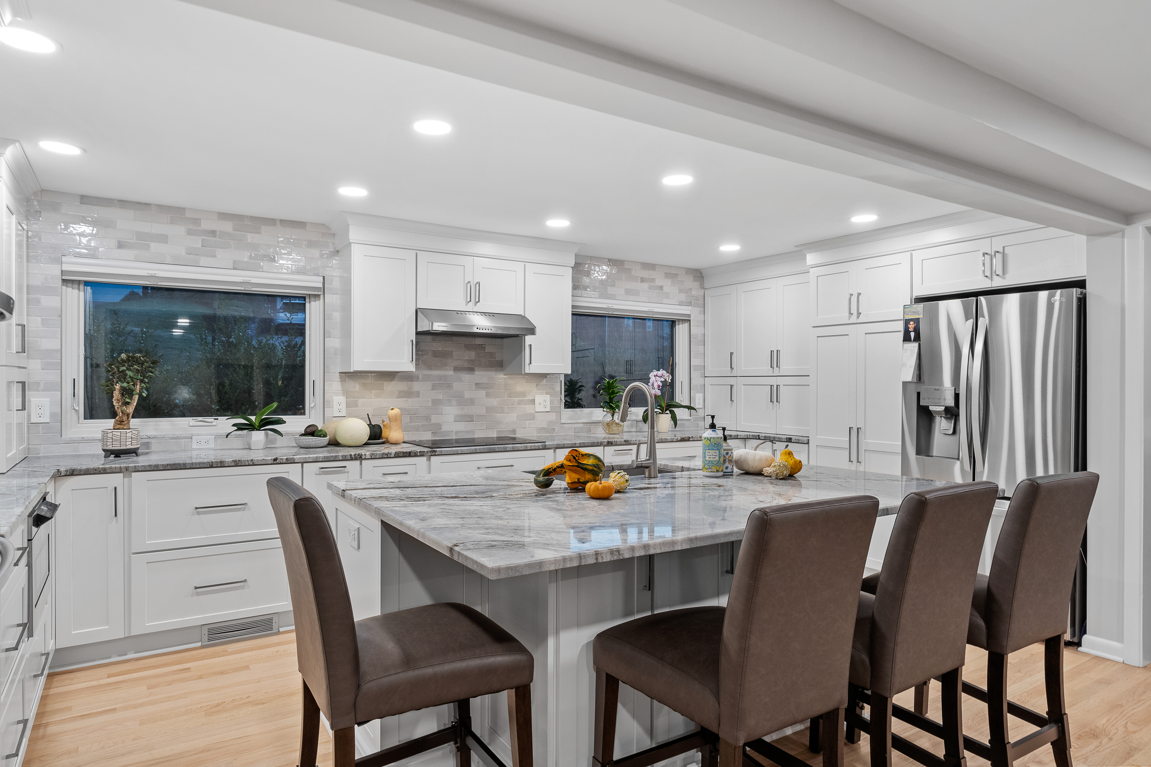 Modern Transitional Mt. Lebanon Kitchen with White Shaker Cabinetry, Sleek Hardware and Custom Built-ins
