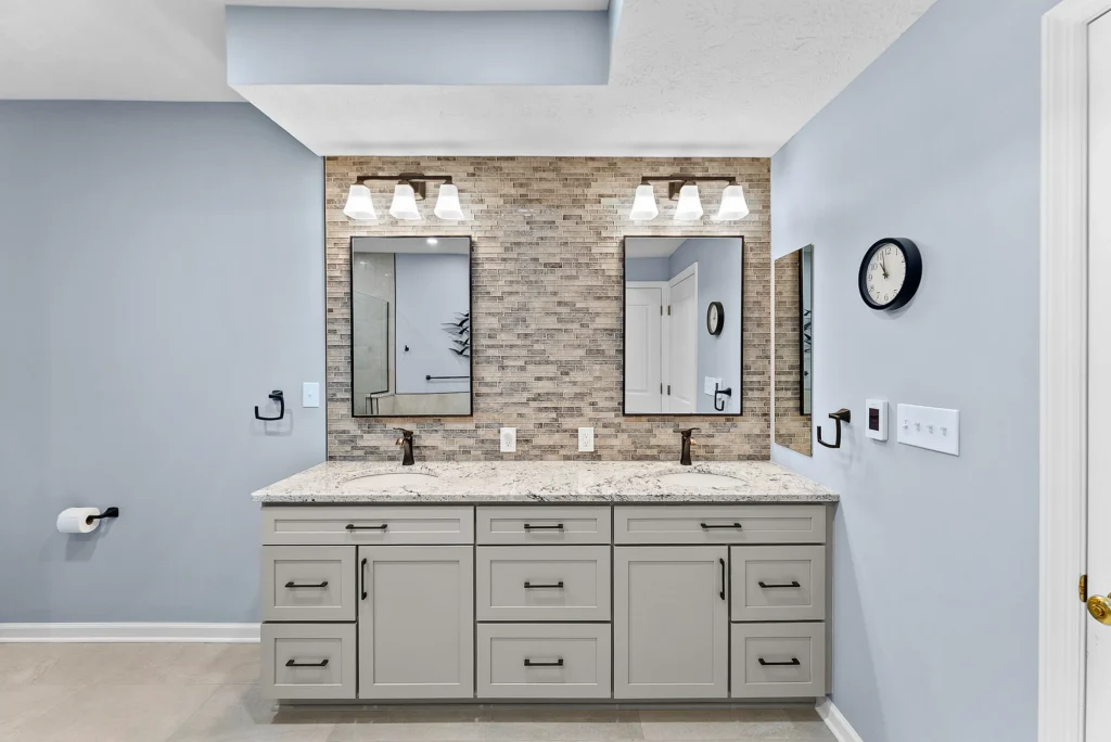 Contemporary Squirrel Hill Master Bathroom with Modern Spa-Inspired Style Featuring a Freestanding Soaking Tub with Sleek Dark Fixtures and Frameless Glass Walk-In Shower