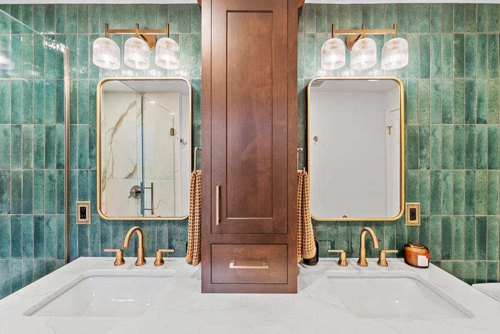 Modern Franklin Park Master Bathroom with Emerald Green Stacked Vertical Tile Accent Wall, Medium Brown Shaker-Style Cabinets and Cream and Gold Shower.