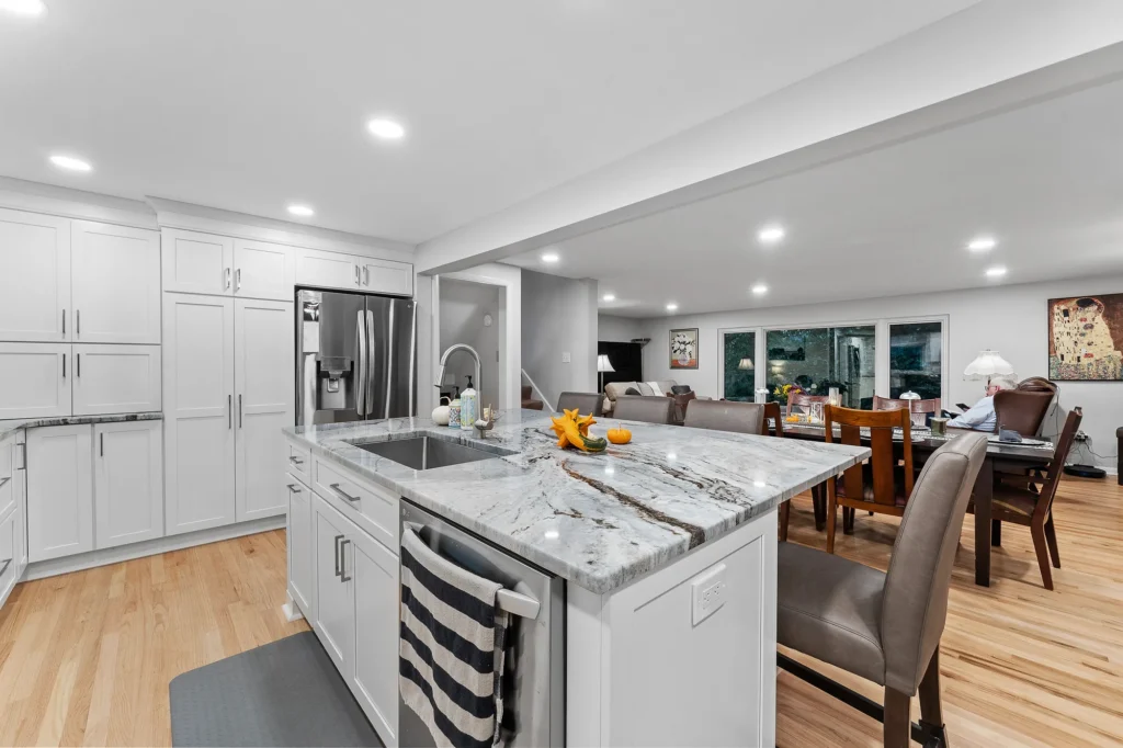 Modern Transitional Mt. Lebanon Kitchen with White Shaker Cabinetry, Sleek Hardware and Custom Built-ins Introduces a Contemporary Edge with a Hint of Sophistication.