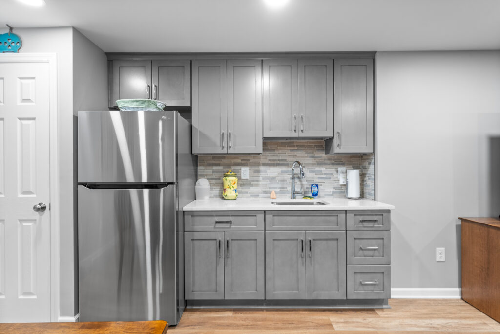 Contemporary Canonsburg Basement and Kitchenette Boasts a Warm Living Space for That Cozy Retreat Feel.