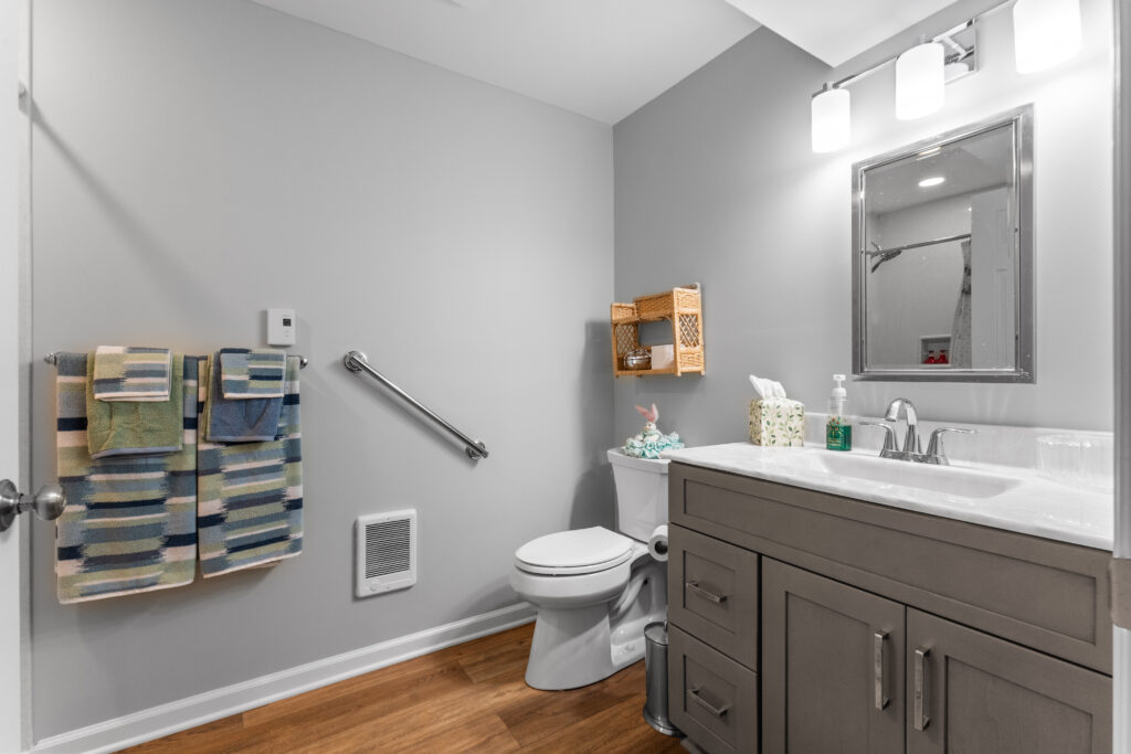 Contemporary Canonsburg Basement and Kitchenette Boasts a Warm Living Space for That Cozy Retreat Feel.