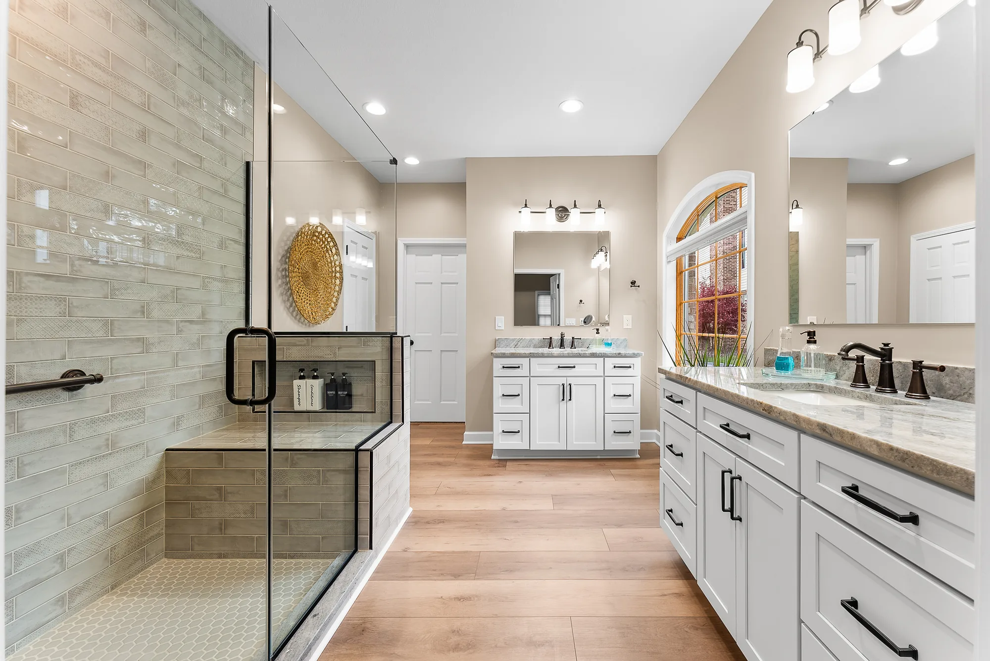 Stunning Beaver Falls Master Bathroom Featuring a Large Walk
-
In Shower with
Glass Enclosure, Built
-
In Bench and Custom Tile Surround.