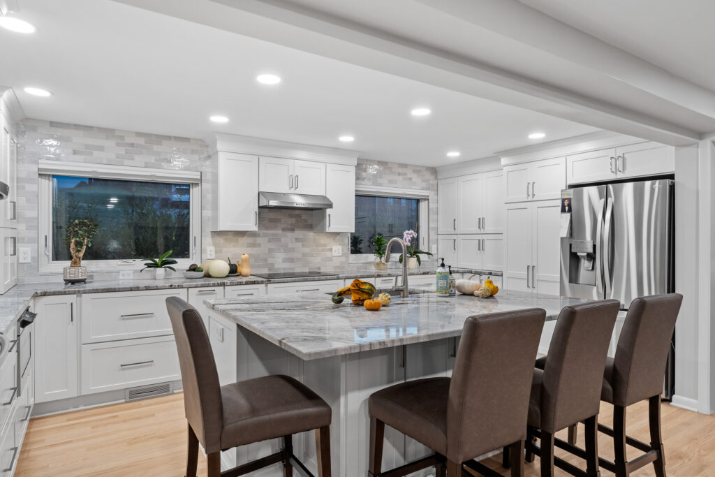 Modern transitional Mt. Lebanon kitchen with white shaker cabinetry, sleek hardware, and custom built-ins.