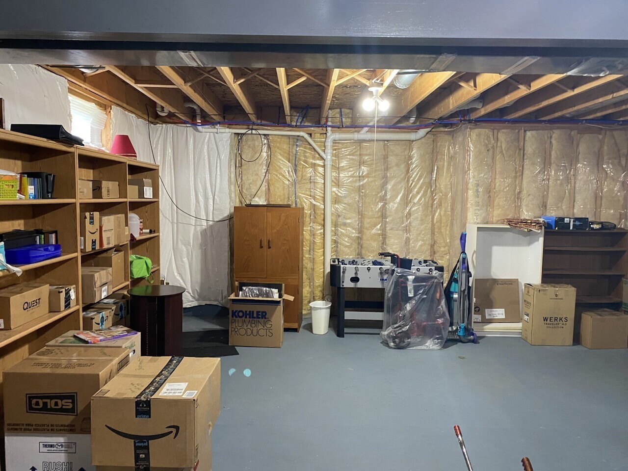 Before photo of the original dark Canonsburg basement before Pittsburgh's Best Remodeling.