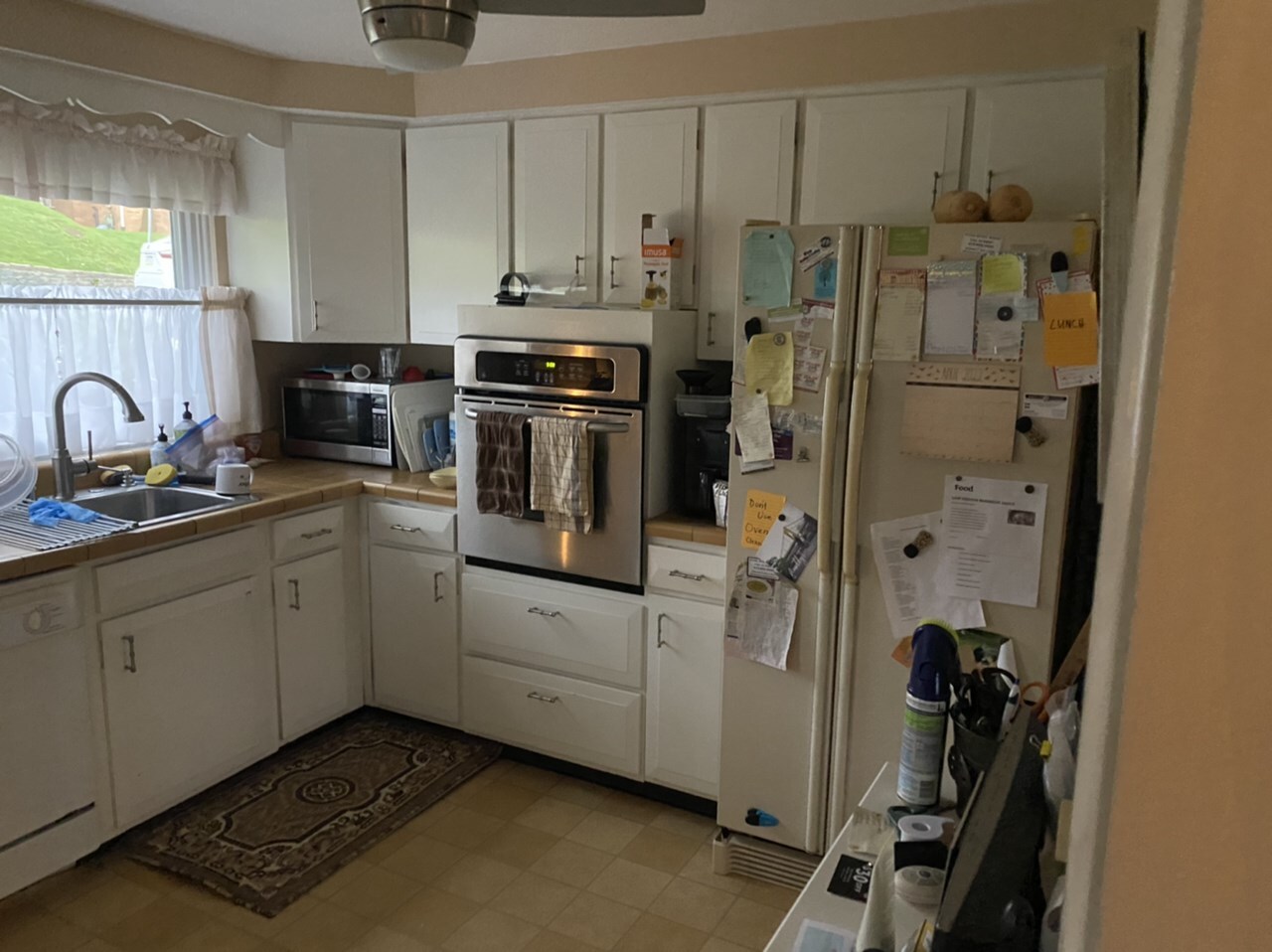 Before photo of the original Mt. Lebanon kitchen with painted white oak cabinetry before Pittsburgh's Best Remodeling.