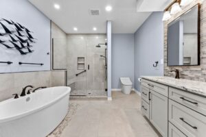 (This Contemporary Squirrel Hill Master Bathroom with Modern Spa-Inspired Style Utilizing a Freestanding Soaking Tub)