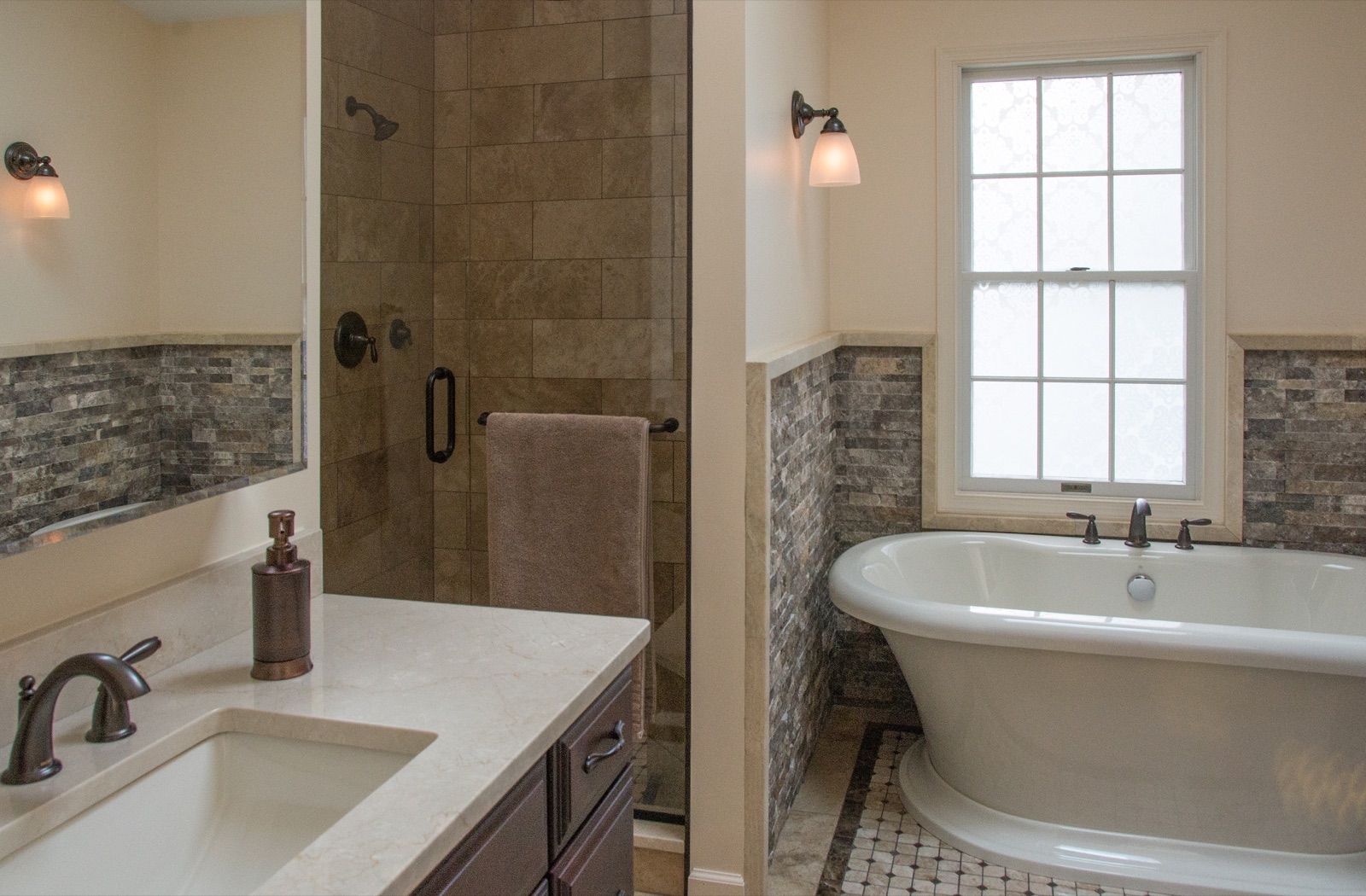 Rustic Cranberry master bathroom featuring a stand-alone soaking tub.