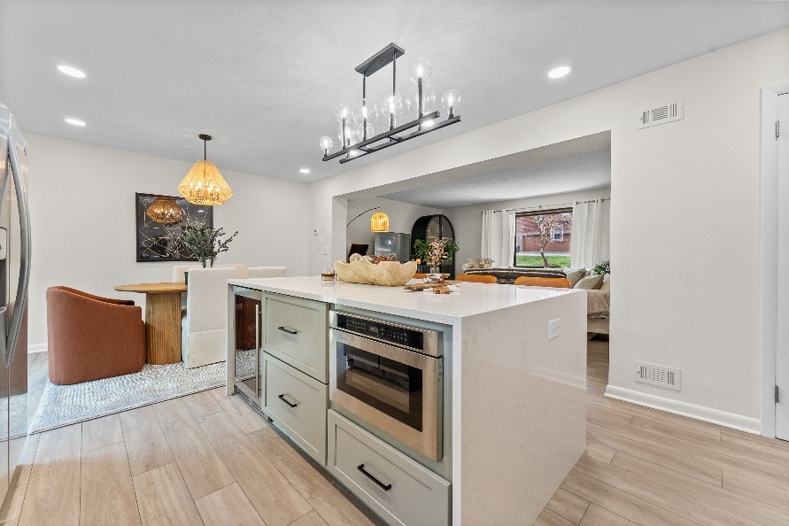 Murrysville kitchen island opening into the remodeled dining and family room.