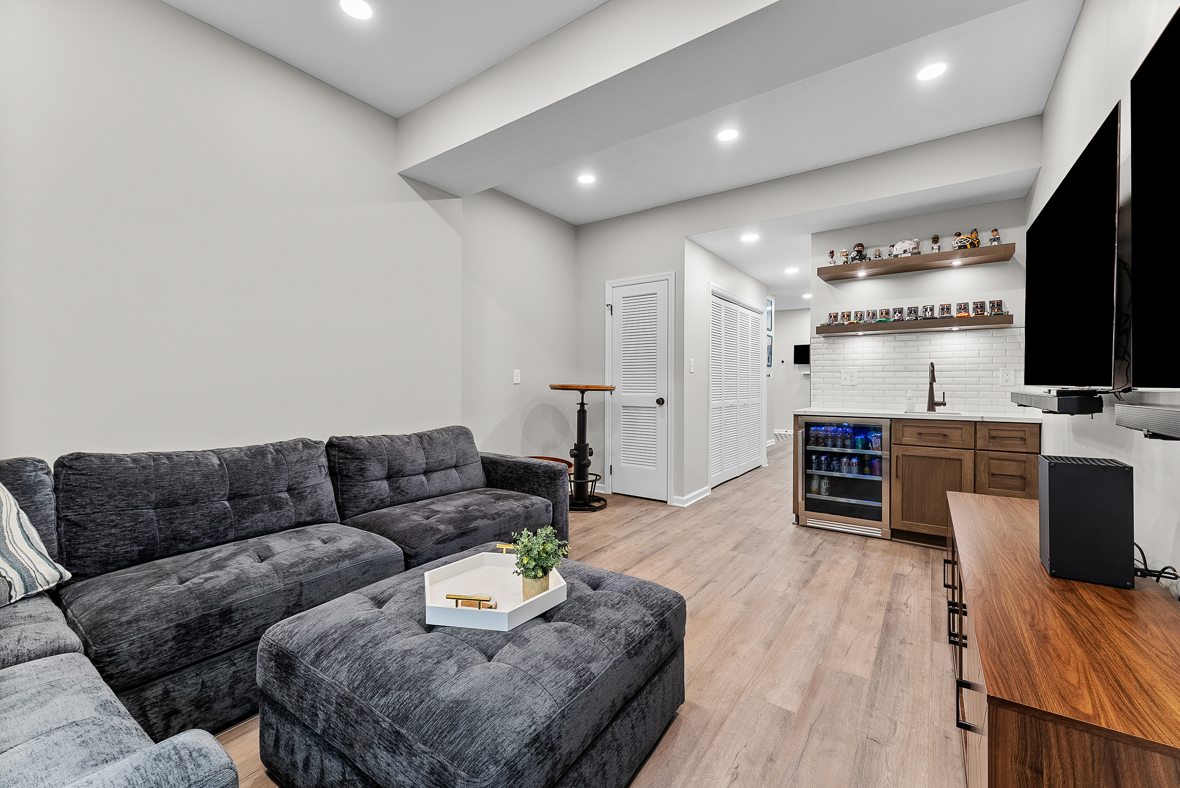 Stylish Wexford Basement Featuring a Cozy Multifunctional Entertainment Area Perfect for Family Time and Hosting Parties