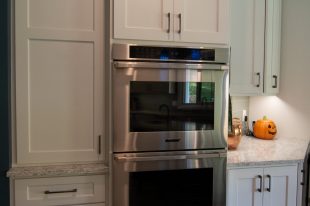 Traditional Style Ross Township Kitchen Using Shaker Doors with White Painted Finish on Island.