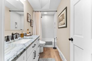 The room’s neutral color palette and luxurious fixtures create a serene ambiance, perfect for relaxation in this Moon Township bathroom.