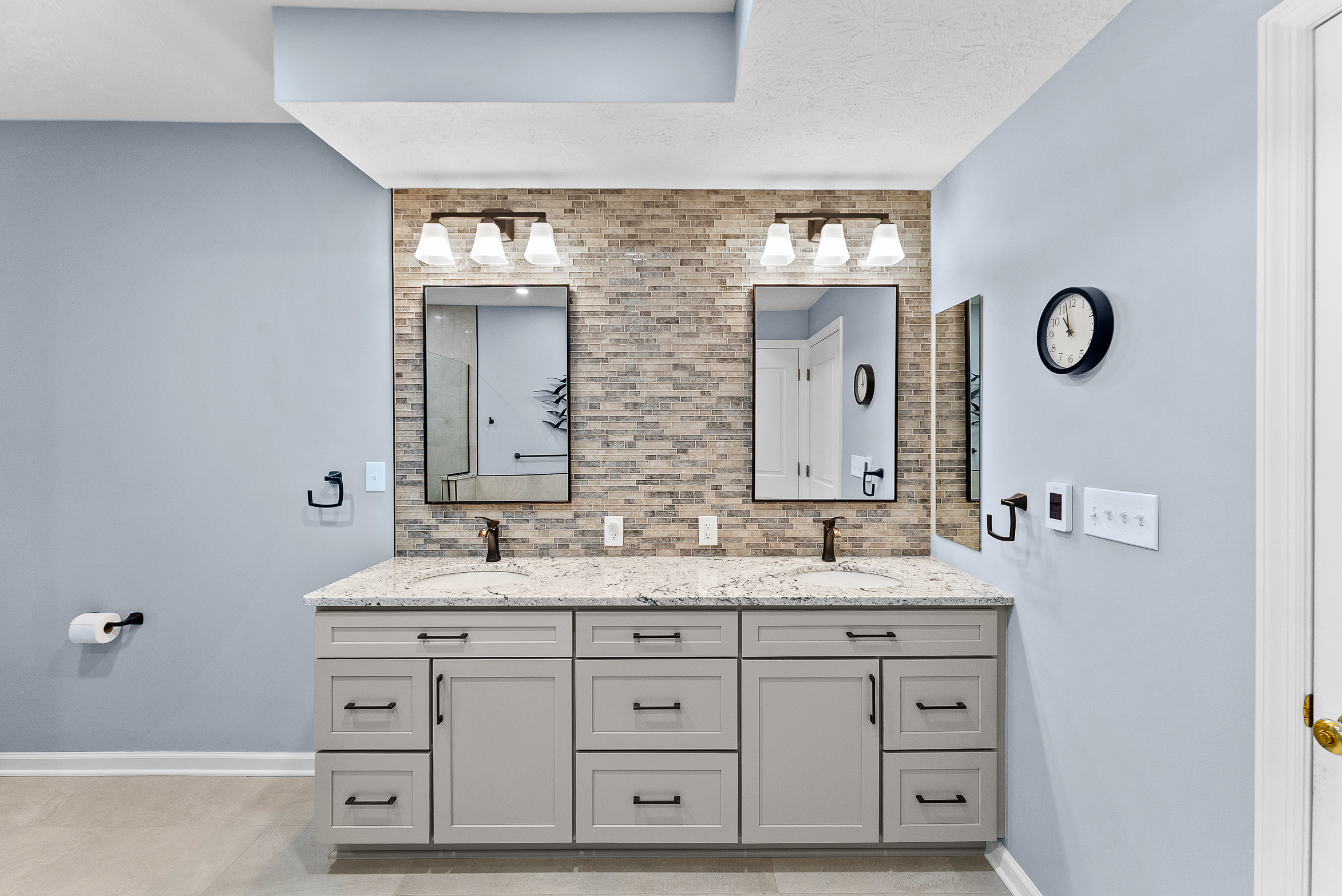 Contemporary Squirrel Hill Master Bathroom with Modern Spa-Inspired Style Featuring a Freestanding Soaking Tub with Sleek Dark Fixtures and Frameless Glass Walk-In Shower