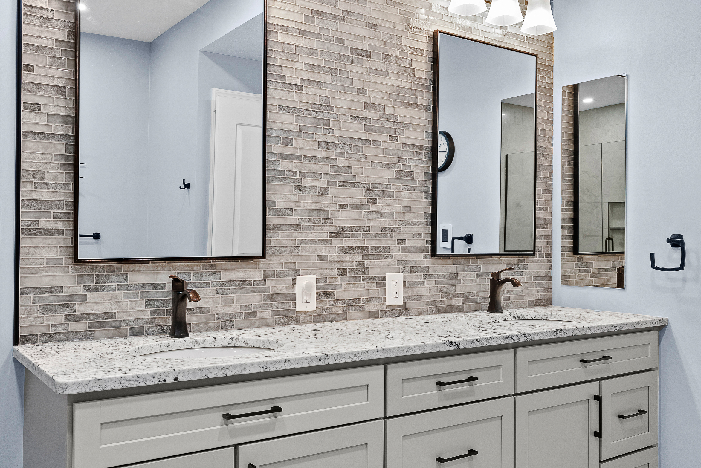 Contemporary Squirrel Hill Master Bathroom with Modern Spa-Inspired Style Featuring a Freestanding Soaking Tub with Sleek Dark Fixtures and Frameless Glass Walk-In Shower