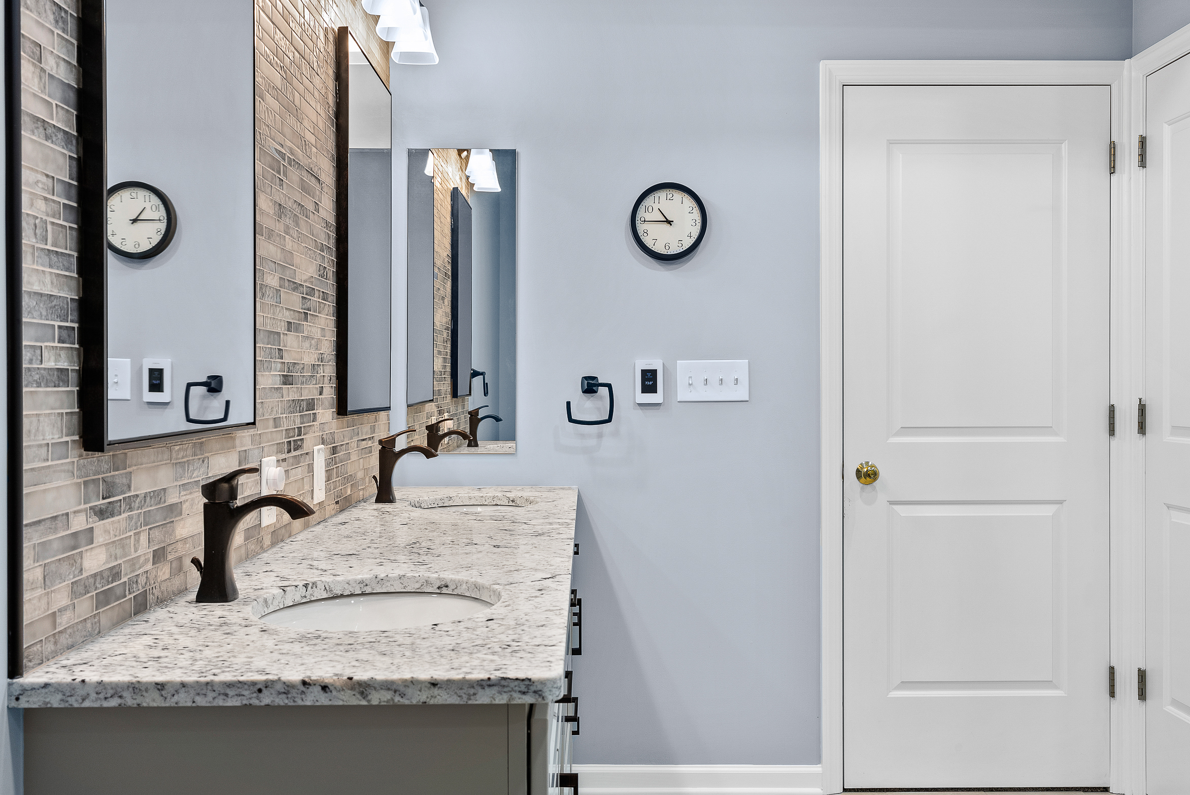 Contemporary Squirrel Hill Master Bathroom with Modern Spa-Inspired Style Featuring a Freestanding Soaking Tub with Sleek Dark Fixtures and Frameless Glass Walk-In Shower