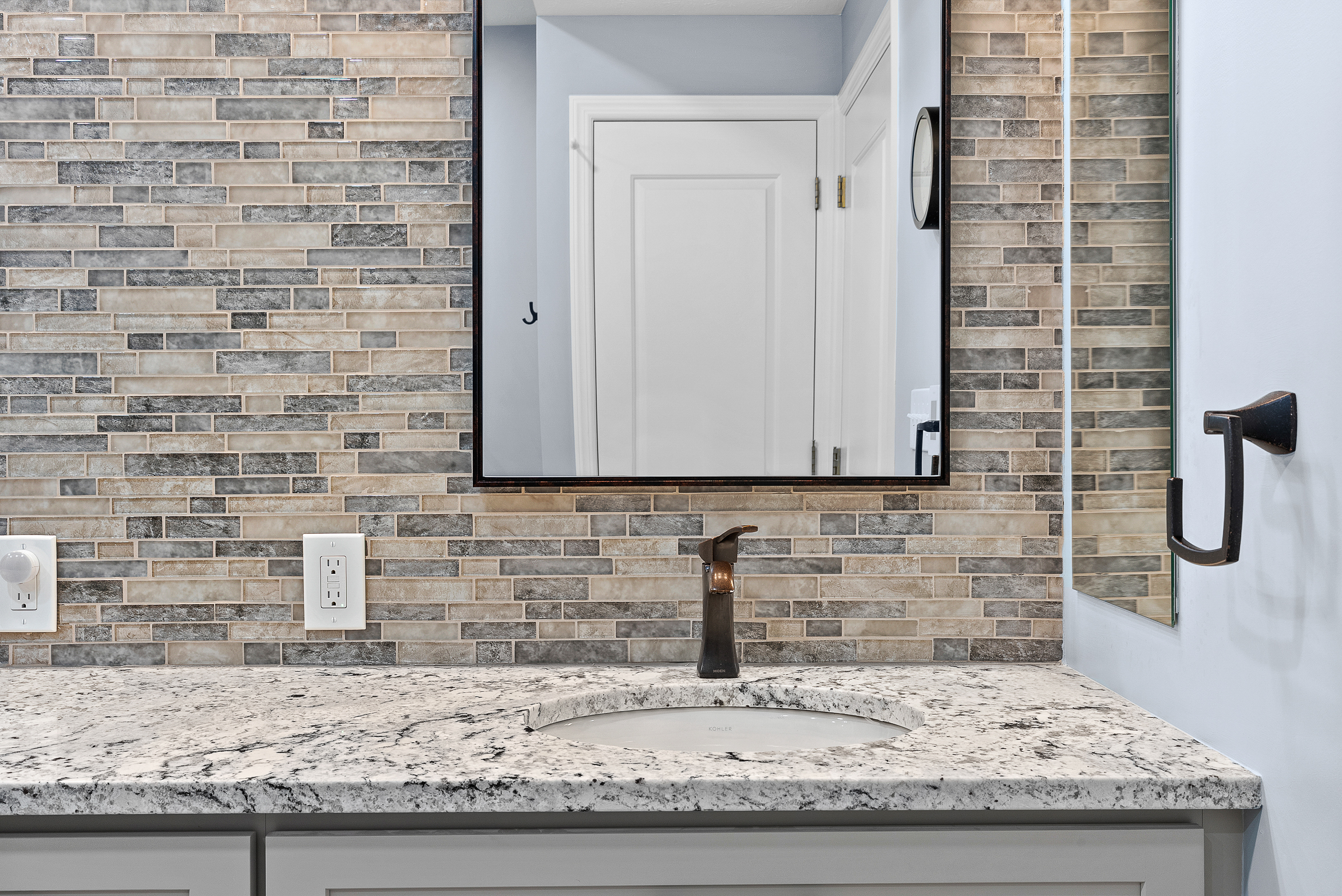Contemporary Squirrel Hill Master Bathroom with Modern Spa-Inspired Style Featuring a Freestanding Soaking Tub with Sleek Dark Fixtures and Frameless Glass Walk-In Shower