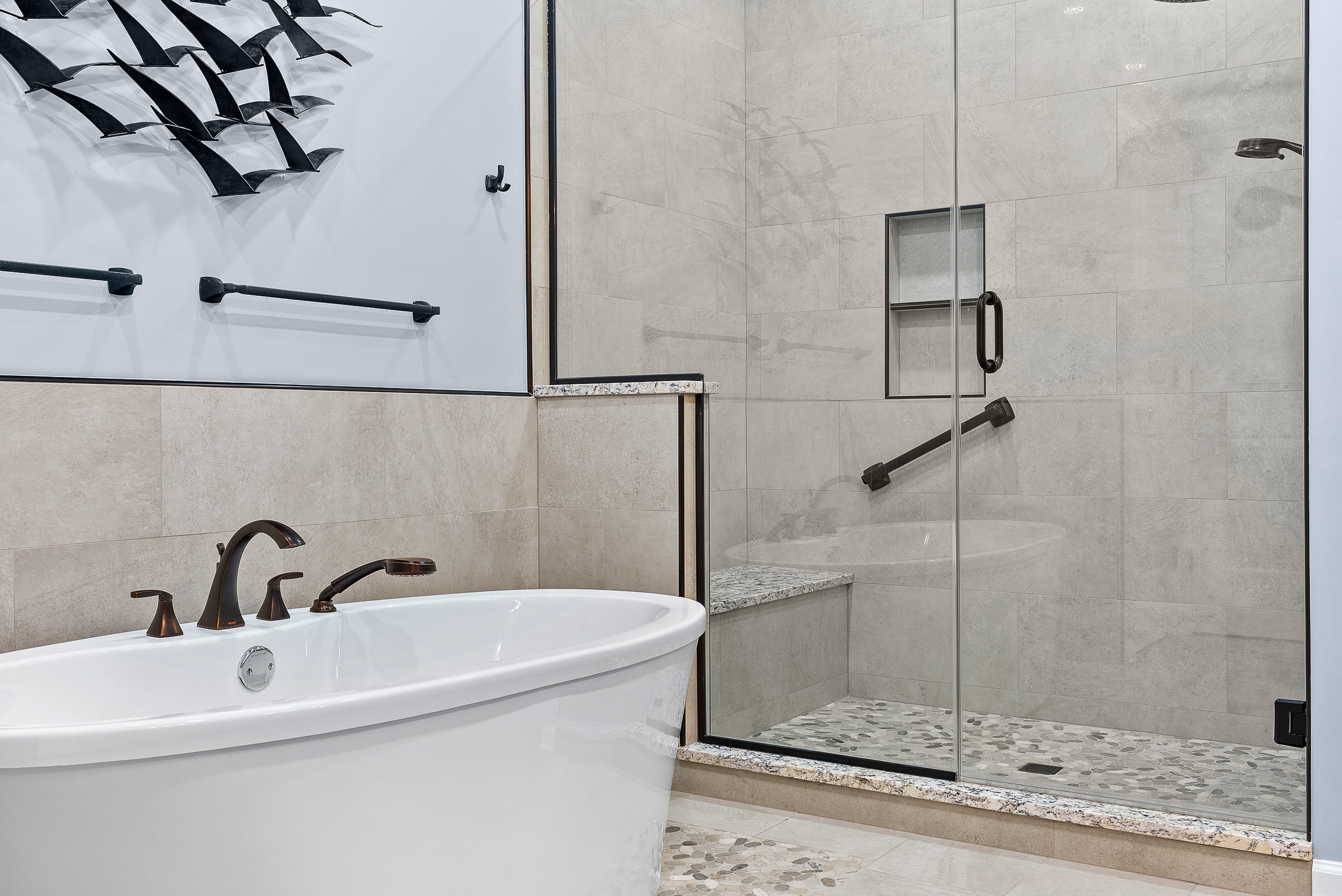 Contemporary Squirrel Hill Master Bathroom with Modern Spa-Inspired Style Featuring a Freestanding Soaking Tub with Sleek Dark Fixtures and Frameless Glass Walk-In Shower