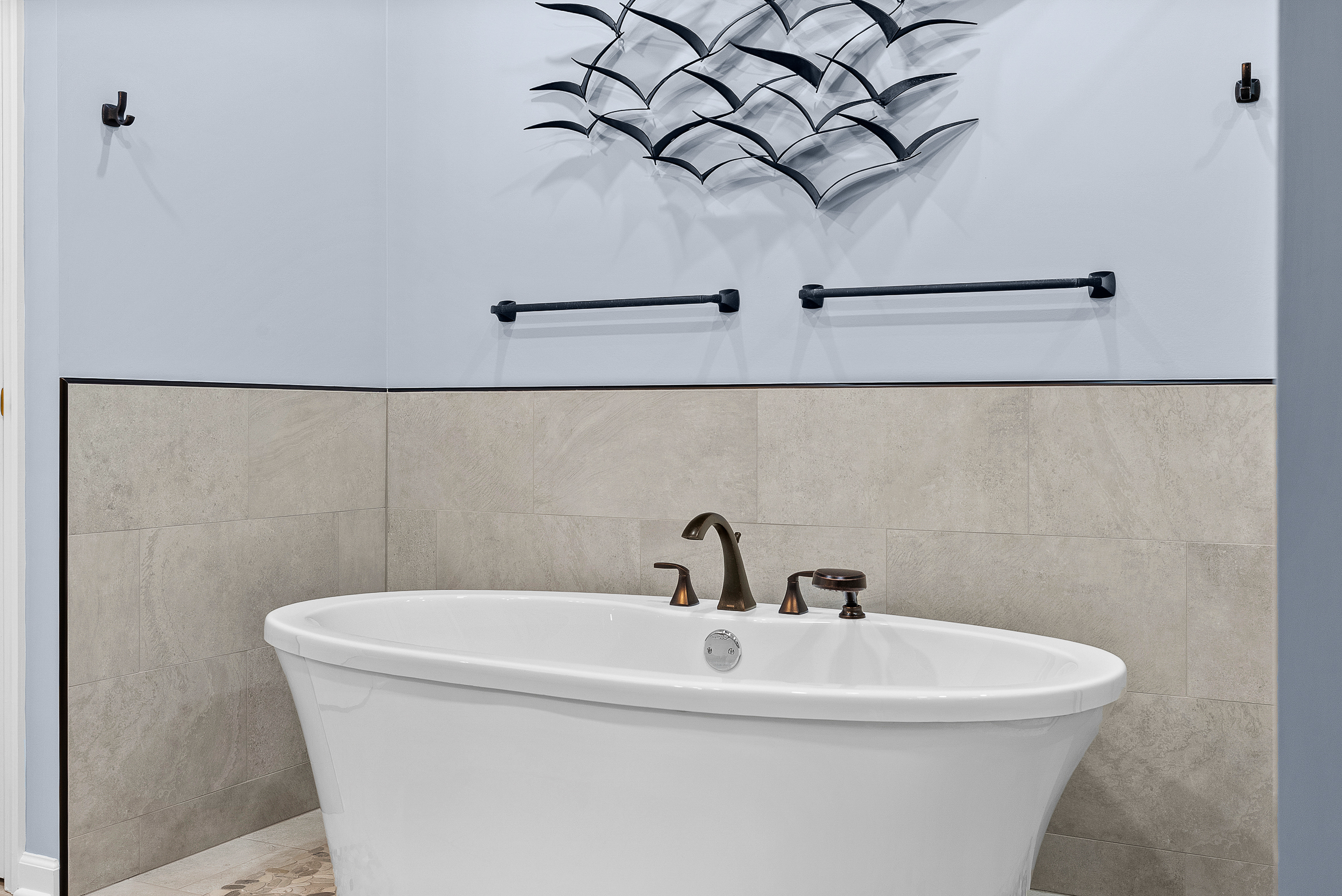 Contemporary Squirrel Hill Master Bathroom with Modern Spa-Inspired Style Featuring a Freestanding Soaking Tub with Sleek Dark Fixtures and Frameless Glass Walk-In Shower