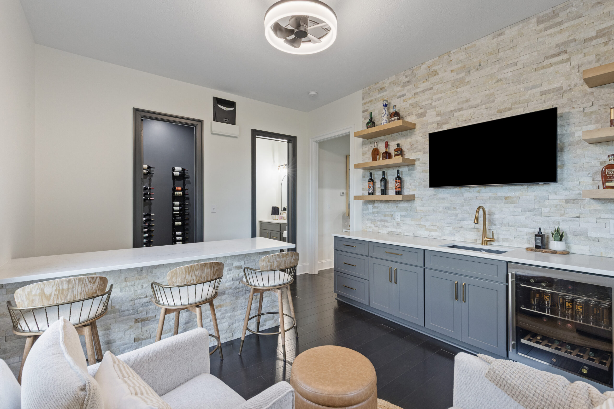 Custom Venetia Wine Room Featuring a Modern Minimalist Design with Floor-to- Ceiling Metal Wine Racks and Refrigeration and Climate Controlled System Perfect for Intimate Wine Tasting Parties